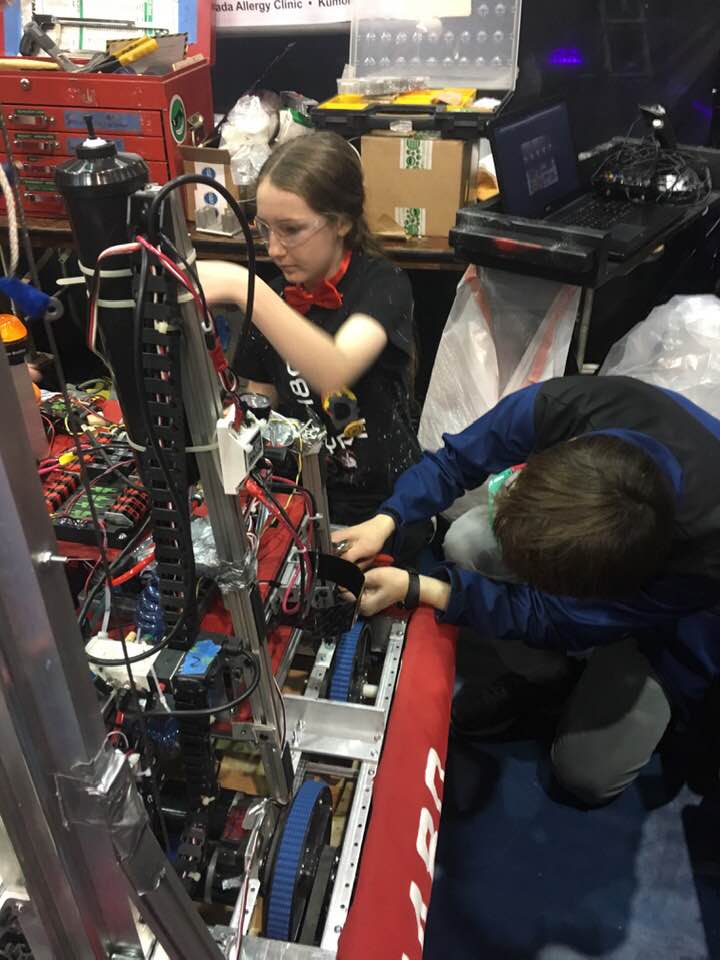 Natalie Mastick works on a robot