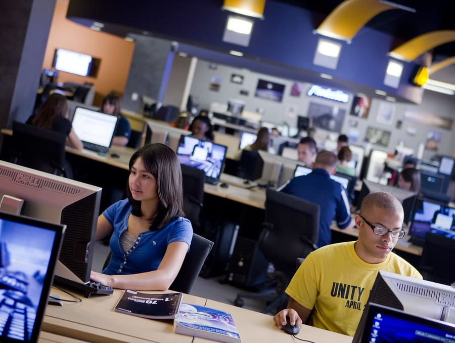 Students working on computers in the @One Computer Lab on campus at the University.