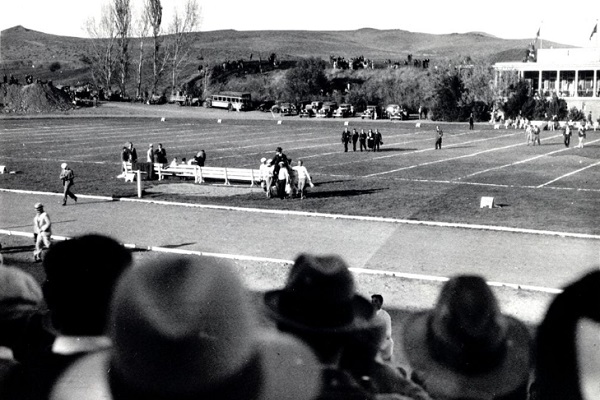 This Mackay Day scene at Homecoming shows a group of men carrying Clarence Mackay across the football field. (1931)