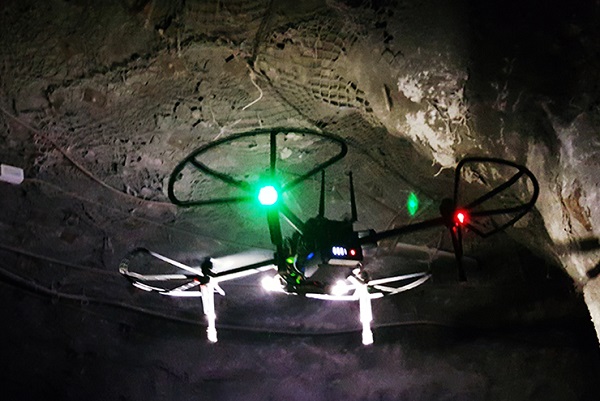The flying drone component off CERBERUS flies through a mine tunnel
