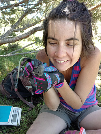 Danielle Miles holding a mouse. 