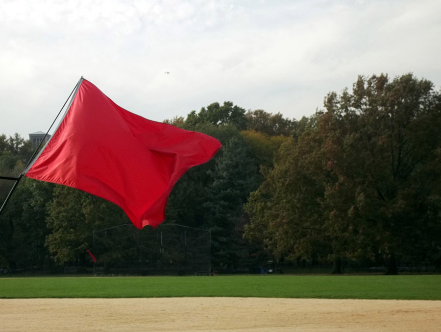 a red flag fluttering in the breeze