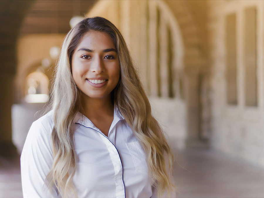 A headshot of Valeria Nava in a hallway.