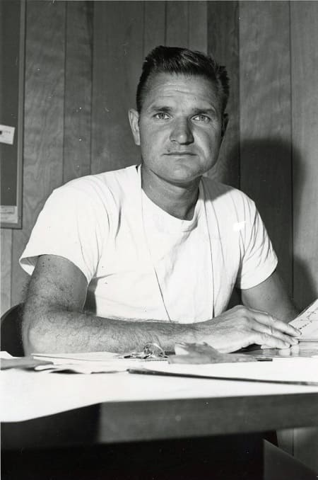 Young Coach Trachok at his desk