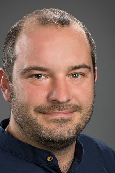 Photo of man with beard in Navy shirt