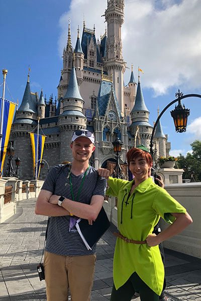 James Rutter poses with a costumed actor at Disney World. 