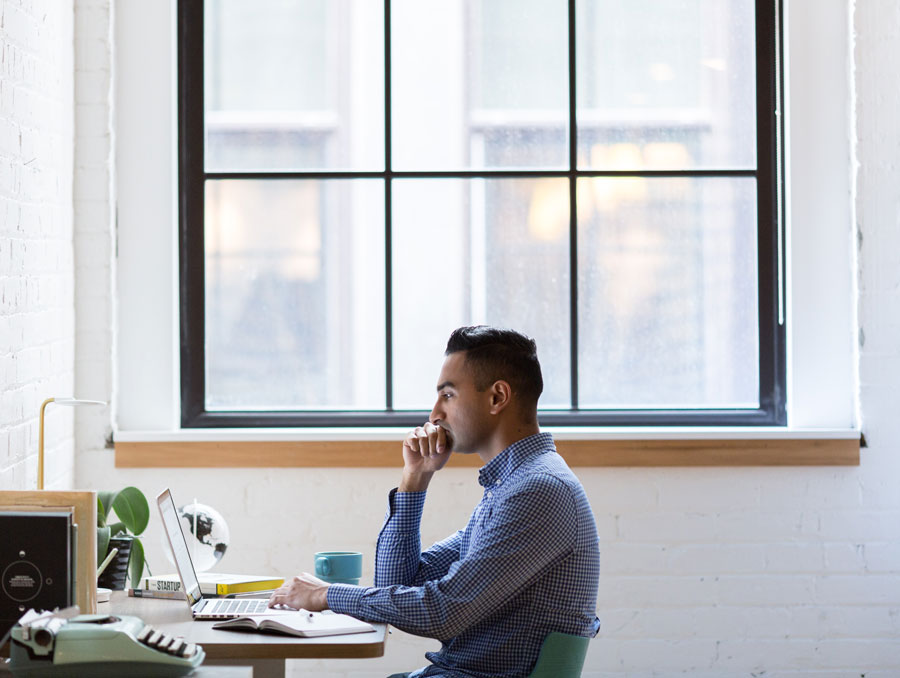 man sitting at a computer