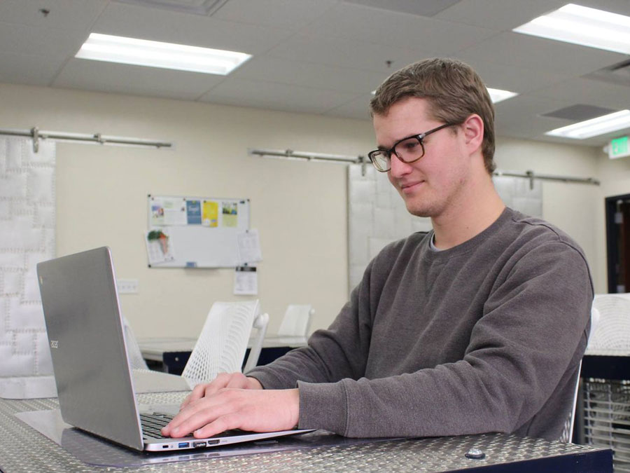 Matt Starrett working on his computer.