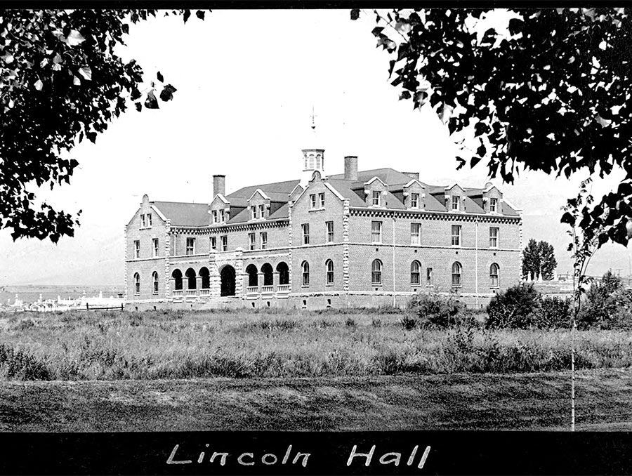 Black and white photograph of a building with written text below that reads "Lincoln Hall"