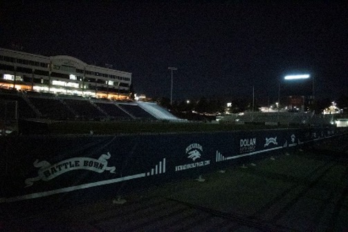 A dark and empty Mackay Stadium devoid of life during the time a football game would have taken place.