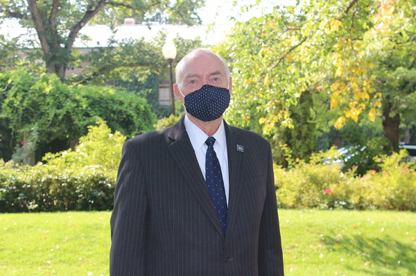 President Marc Johnson wearing a mask