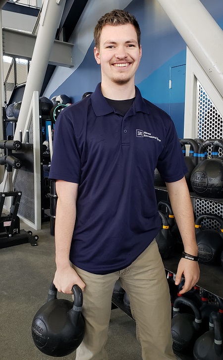 Dalton Taylor holding a kettle bell