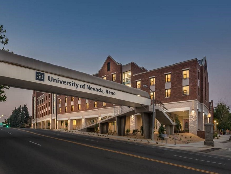 Great Basin Hall viewed from across Virginia St. with the University of Nevada, Reno pedestrian bridge spanning the street