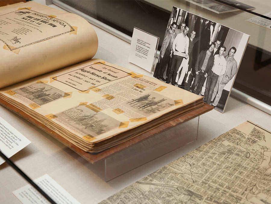 Special Collections book open in front of a photograph