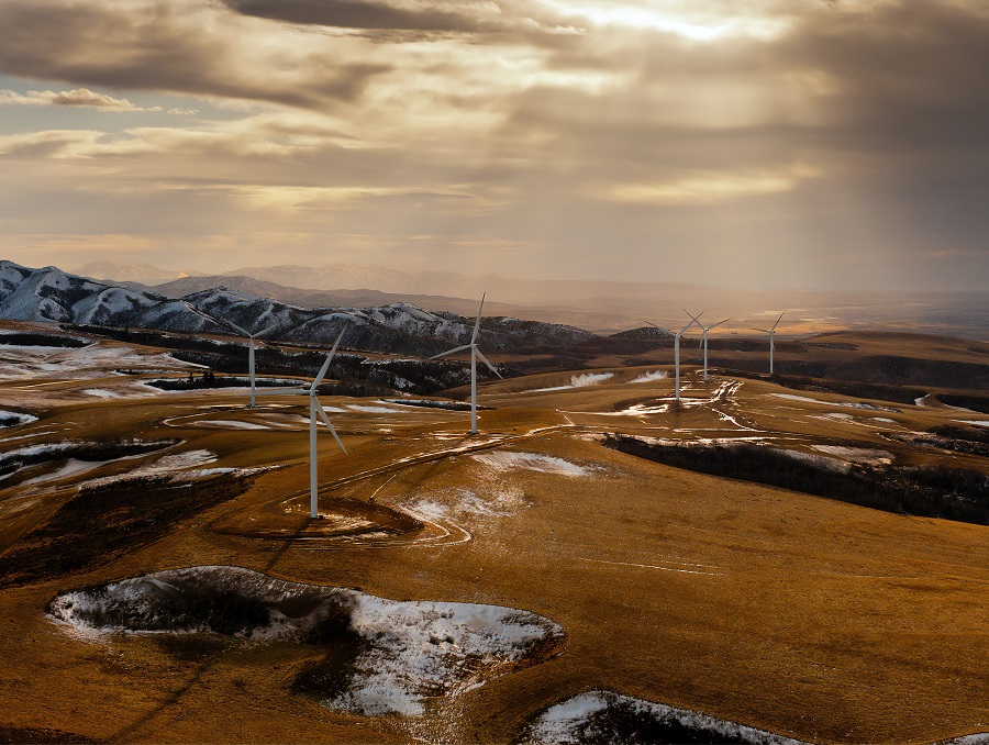 Wind turbines on a snowy desert landscape