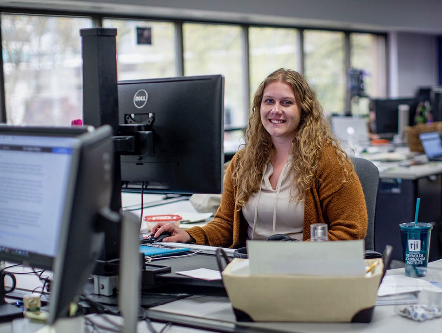 Cambria Roth poses in the office.