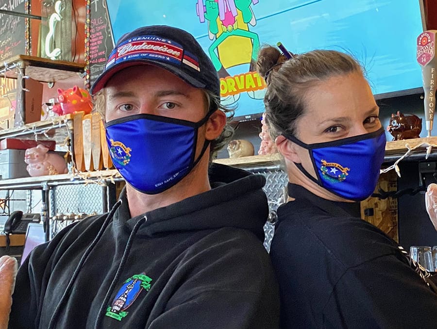 Local small business owners wearing Nevada branded face masks.