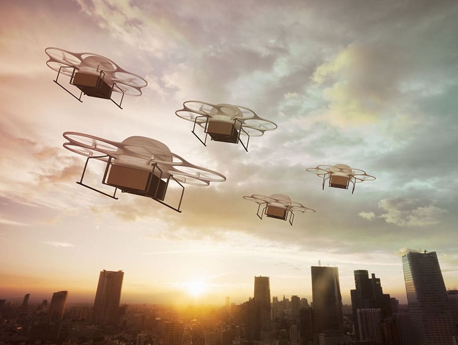 Drones in the sky above a city.