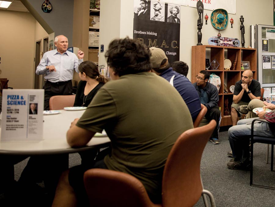 Mick Hitchcock speaks to a room full of University students.