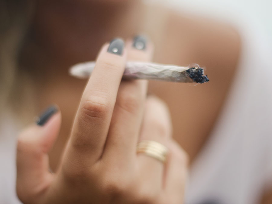 Person holding a cannabis blunt