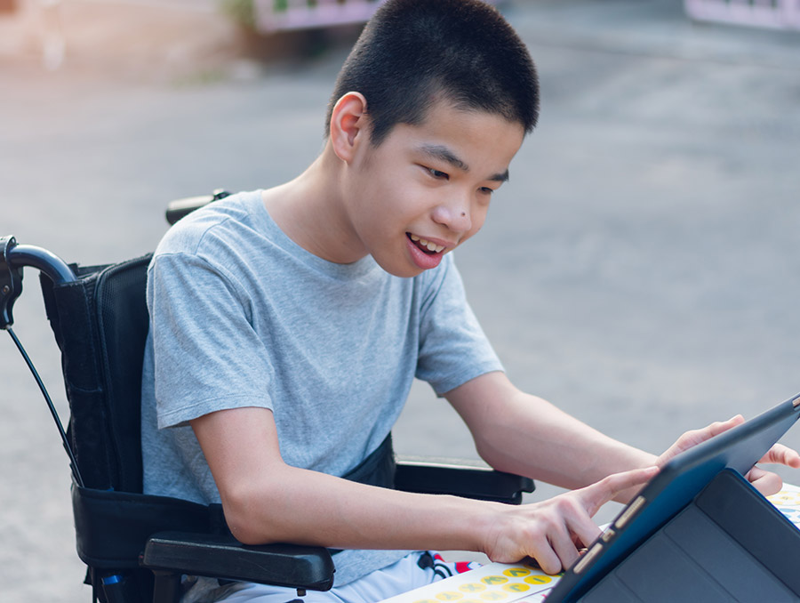 Student with special needs on a tablet computer