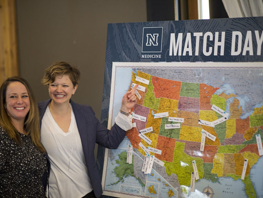 A UNR Med medical student places a pin on the Match Day map.