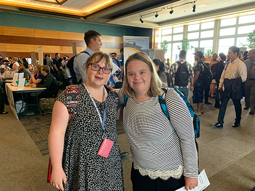 Two students at a recruiting event on campus