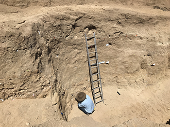 digging in bottom of earthquake ttrench