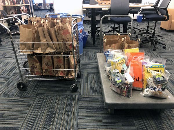 Bags of groceries and supplies loaded up and ready to be taken to students in need