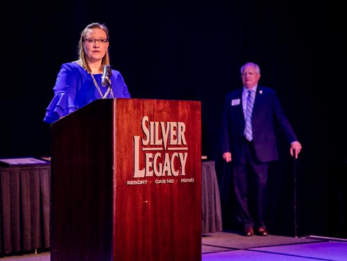 Annie Huhta addresses the crowd at the Mackay Banquet.