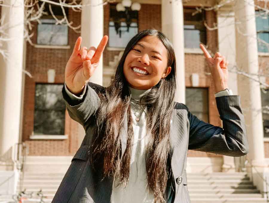 A photo of Steffany Yang in front of Palmer Engineering.