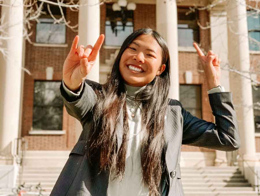 A photo of Steffany Yang in front of Palmer Engineering. 