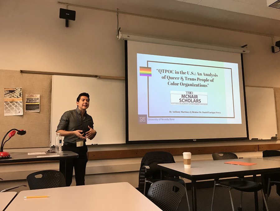 McNair Program Scholar Anthony Martinez gives a research presentation in a classroom at the University of Nevada, Reno