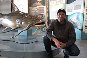 Zeb Hogan with Monster Fish museum exhibition