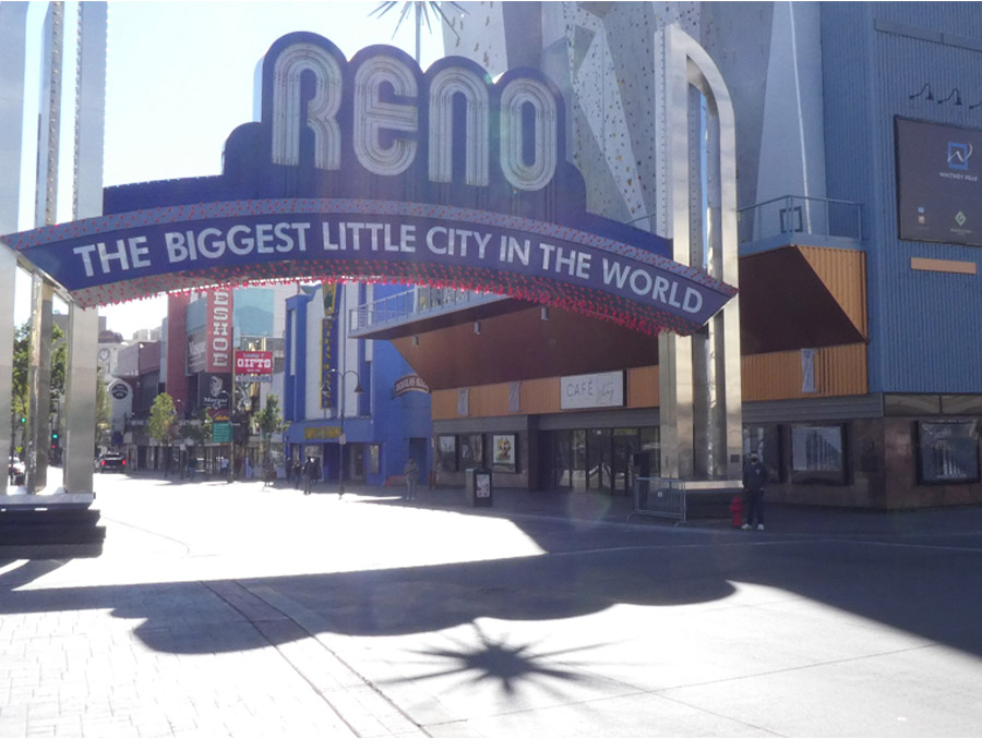 The author, standing at the base of the Reno Arch, surrounded by empty streets during the COVID-19 Pandemic