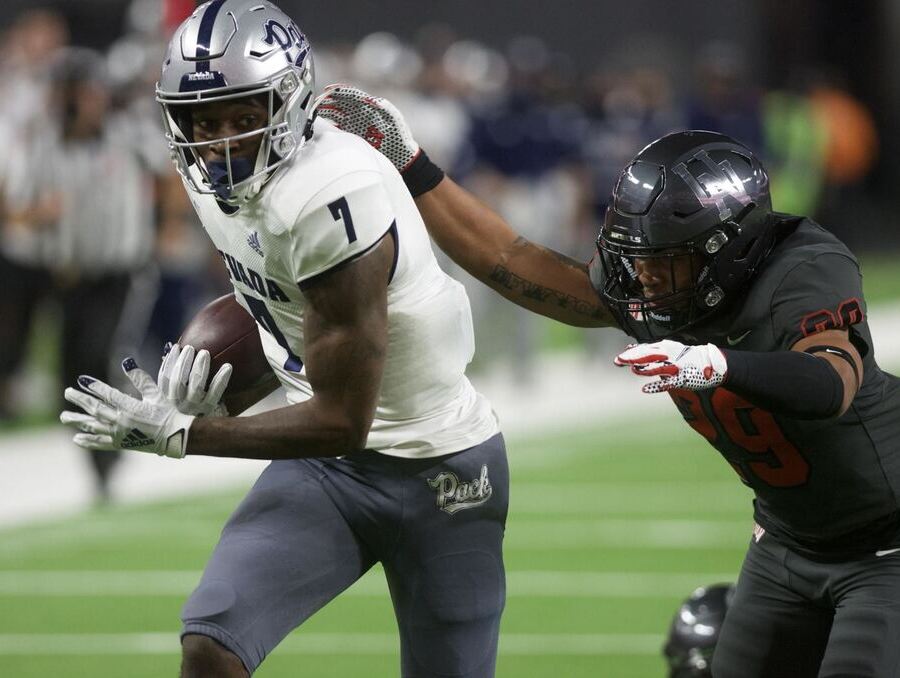 Wolf Pack receiver Romeo Doubs with the ball