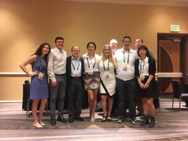 A group of student stand for a picture with the Reynolds School of Journalism's Dean Stavitsky during a conference put on by the Native American Journalism Association.