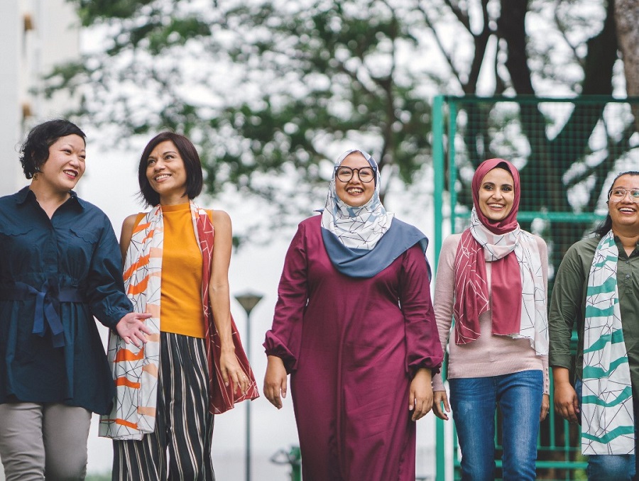 group of diverse women walking together 