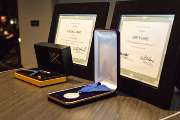 Photo of gifts given to Nevada Writers Hall of Fame Inductee and Silver Pen awardee -  the silver pen writing instrument and the 2019 Nevada Writers Hall of Fame induction medallion