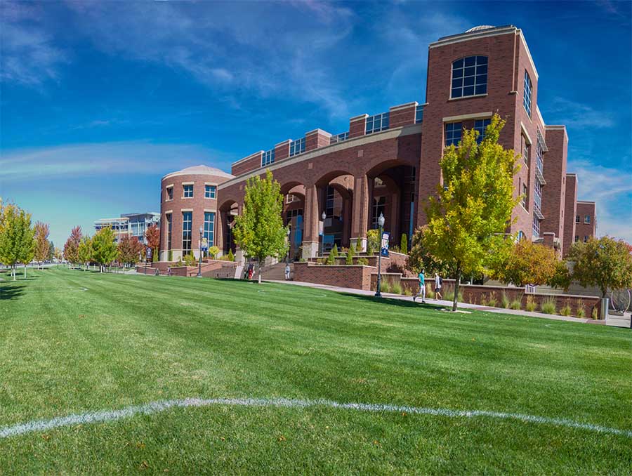 Angled view of the front of the Knowledge Center library during summer day