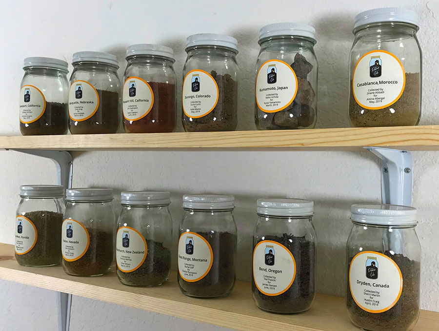 Jars of soil sit on shelves