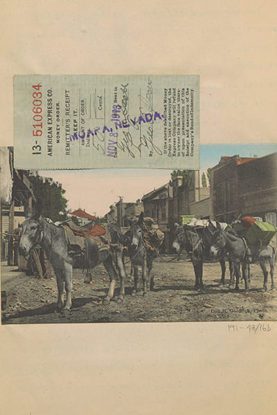 Scanned image of a group of saddled donkeys in a town.