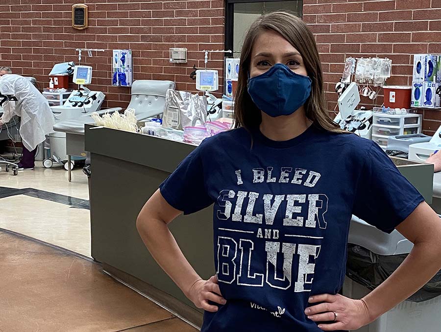 Person in mask wearing "I Bleed Silver and Blue" T-shirt 