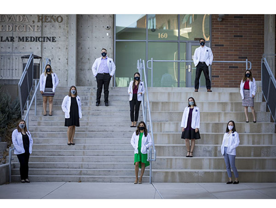 A socially distanced group photo of 10 medical students who are creating and teaching curriculum on preventative care and healthy lifestyle choices for high school students.