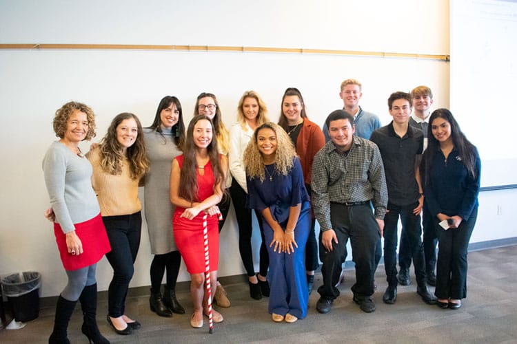 Group of students pose indoors