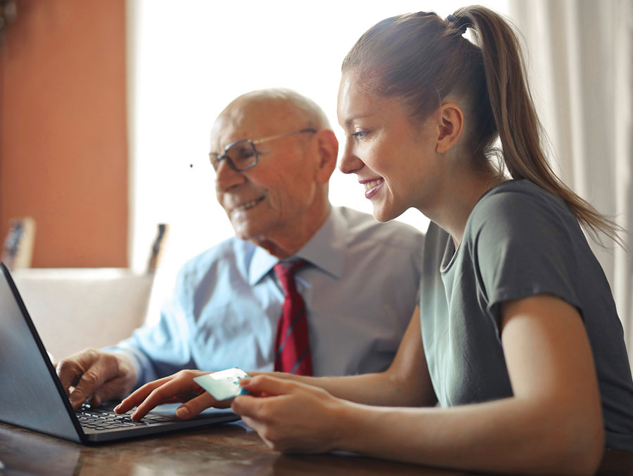 Woman and man looking at a computer 