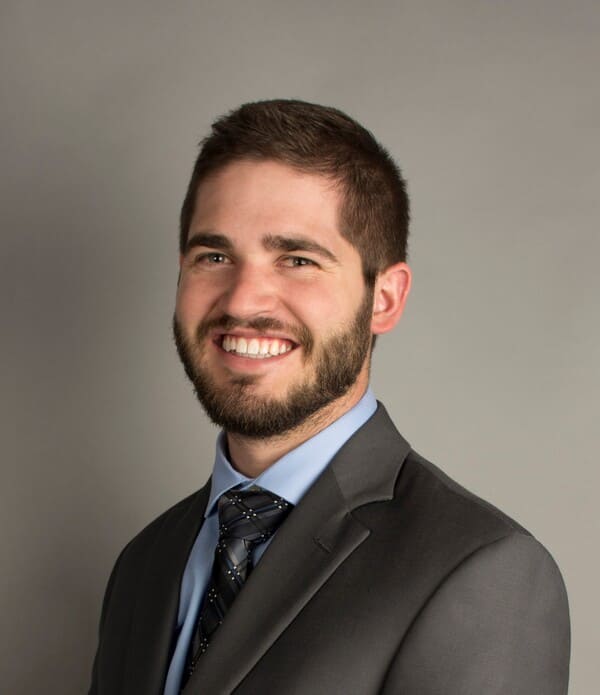 A close up of Tim Robb smiling to camera.