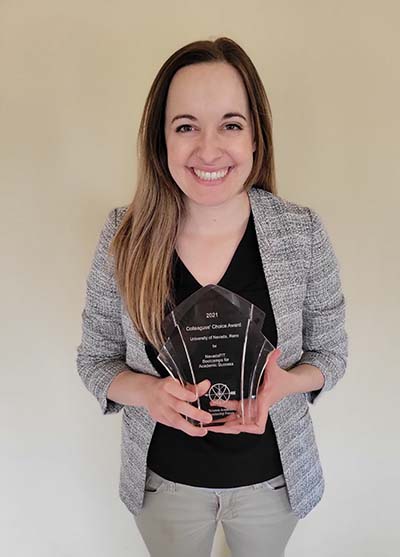 Felicia DeWald holds Colleagues' Choice Award