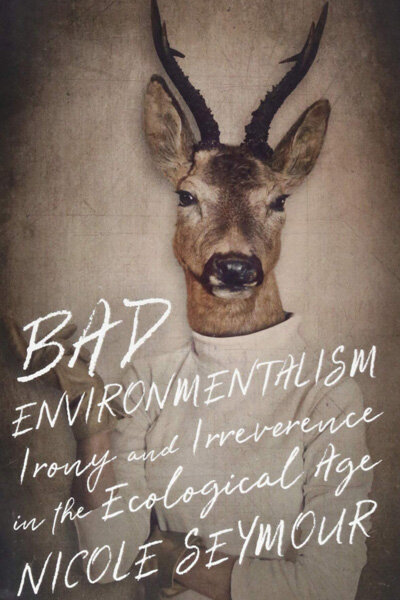 Book Cover Art: “Bad Environmentalism” Irony and Irreverence in the Ecological Age by Nicole Seymour. Image on the cover is of a Buck wearing a white turtleneck shirt, with human arms somewhat crossed with one hand resting under the opposite arm’s elbow, in a slightly crossed position.