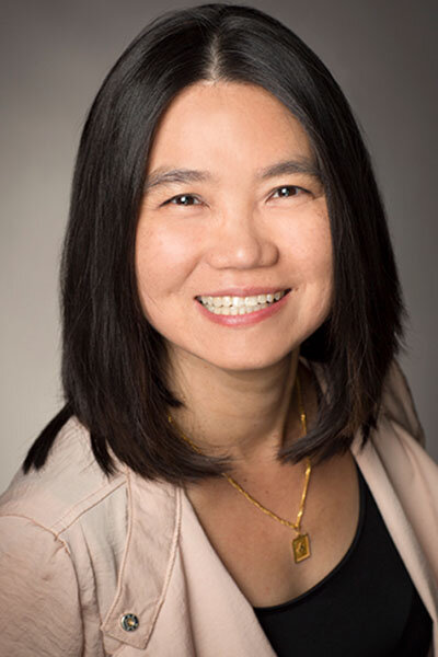 Image of woman with glasses and shoulder-length dark hair